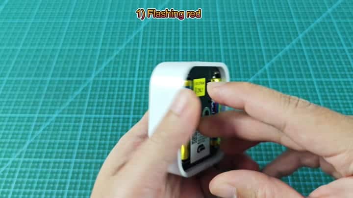 AA battery inserted into white charger AA battery inserted into white charger