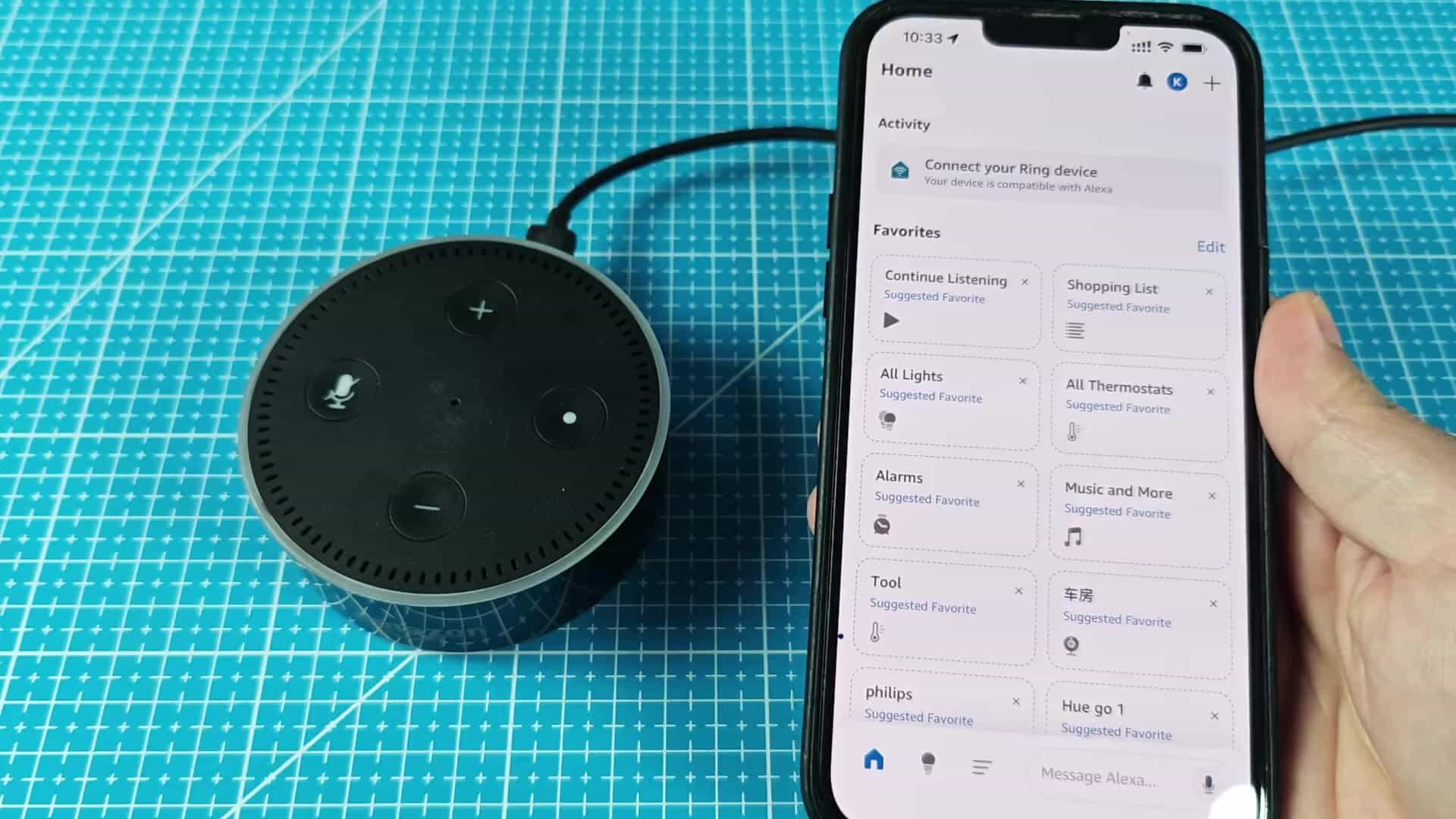 Alexa app home screen with smart speaker Alexa app home screen with smart speaker