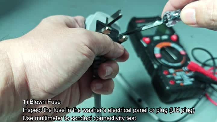 Blown UK plug fuse with multimeter Blown UK plug fuse with multimeter