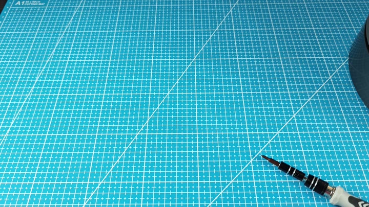 Blue cutting mat with screwdriver Blue cutting mat with screwdriver
