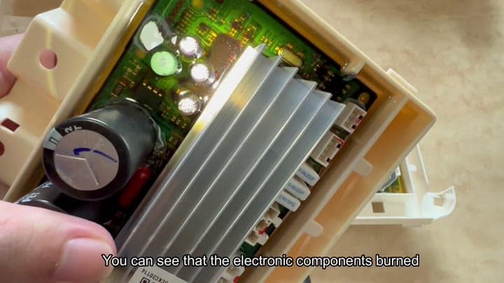 Burned electronic components on circuit board Burned electronic components on circuit board