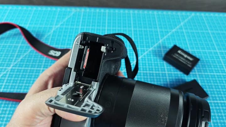 Camera battery compartment door open wide Camera battery compartment door open wide