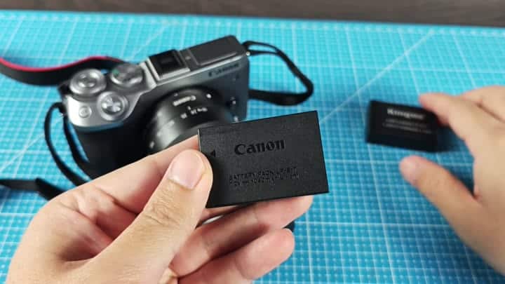 Canon LP-E17 battery on grid mat Canon LP-E17 battery on grid mat
