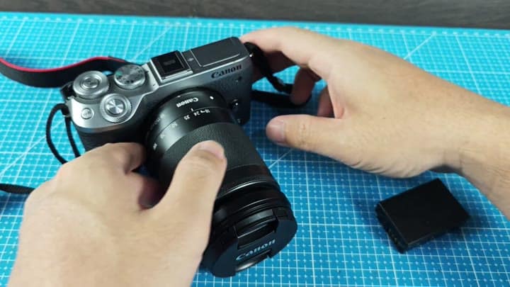 Canon mirrorless camera with lens attached Canon mirrorless camera with lens attached