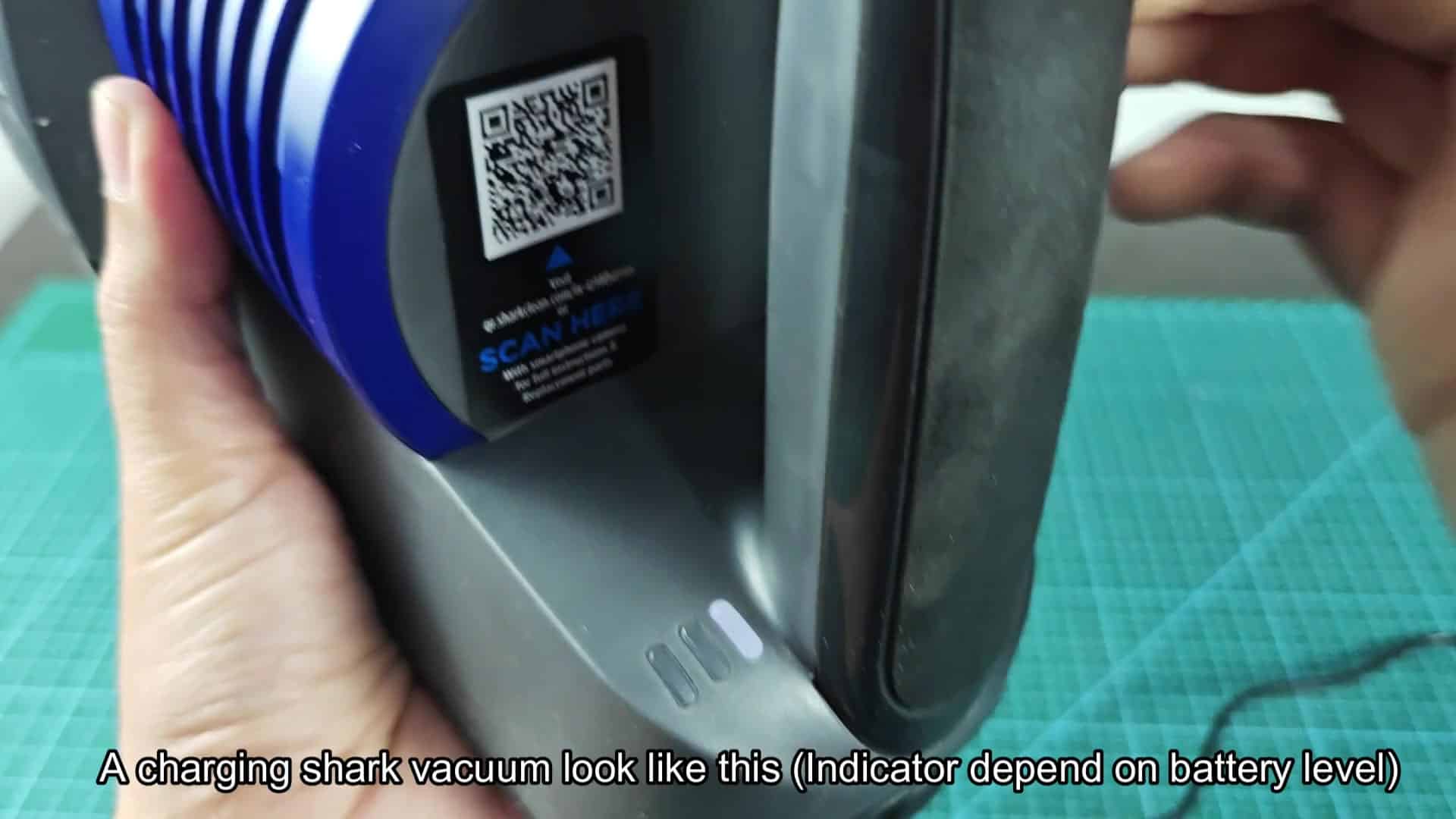Charging cable plugged into vacuum base Charging cable plugged into vacuum base