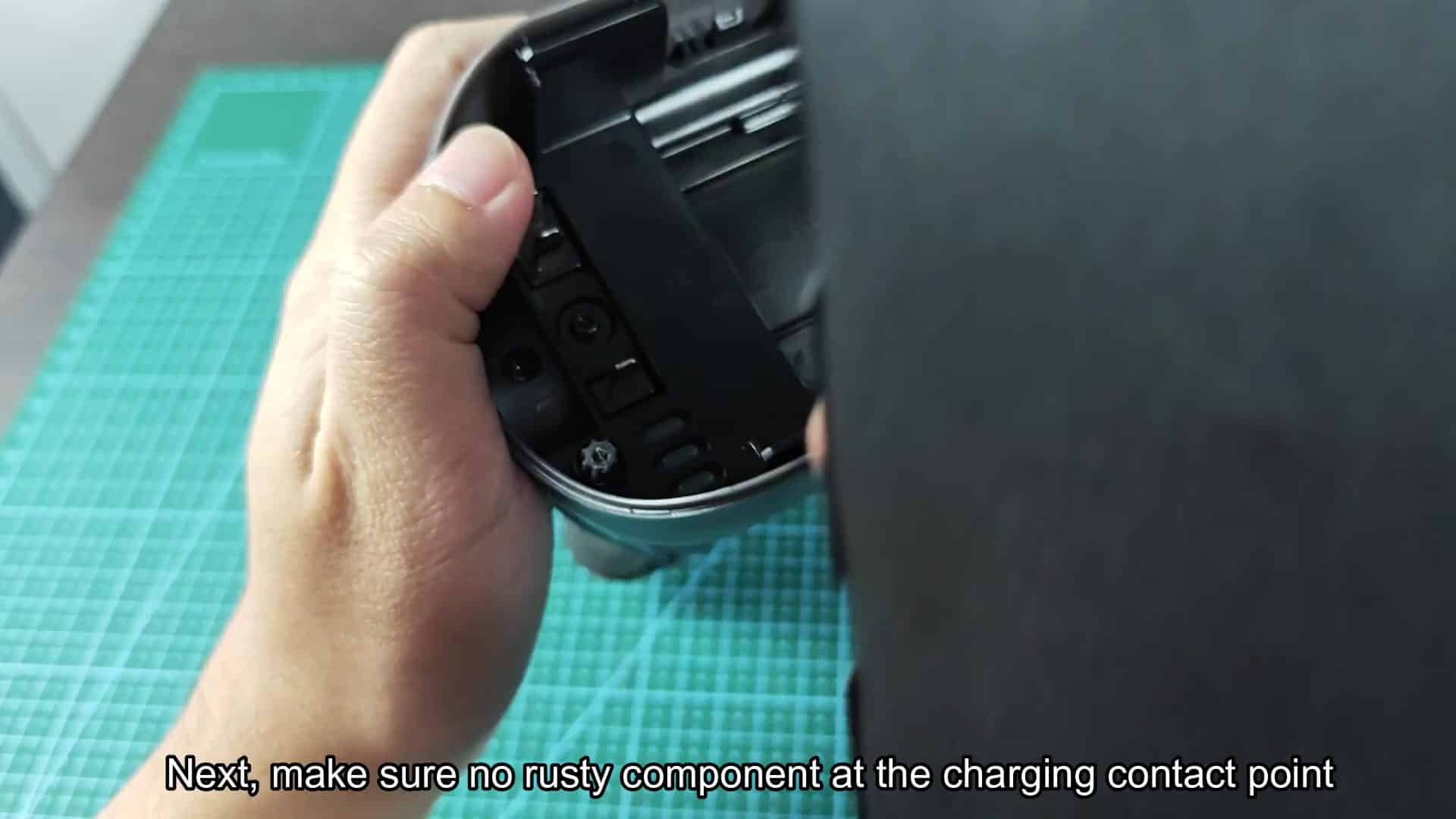 Checking charging contact pins for rust Checking charging contact pins for rust