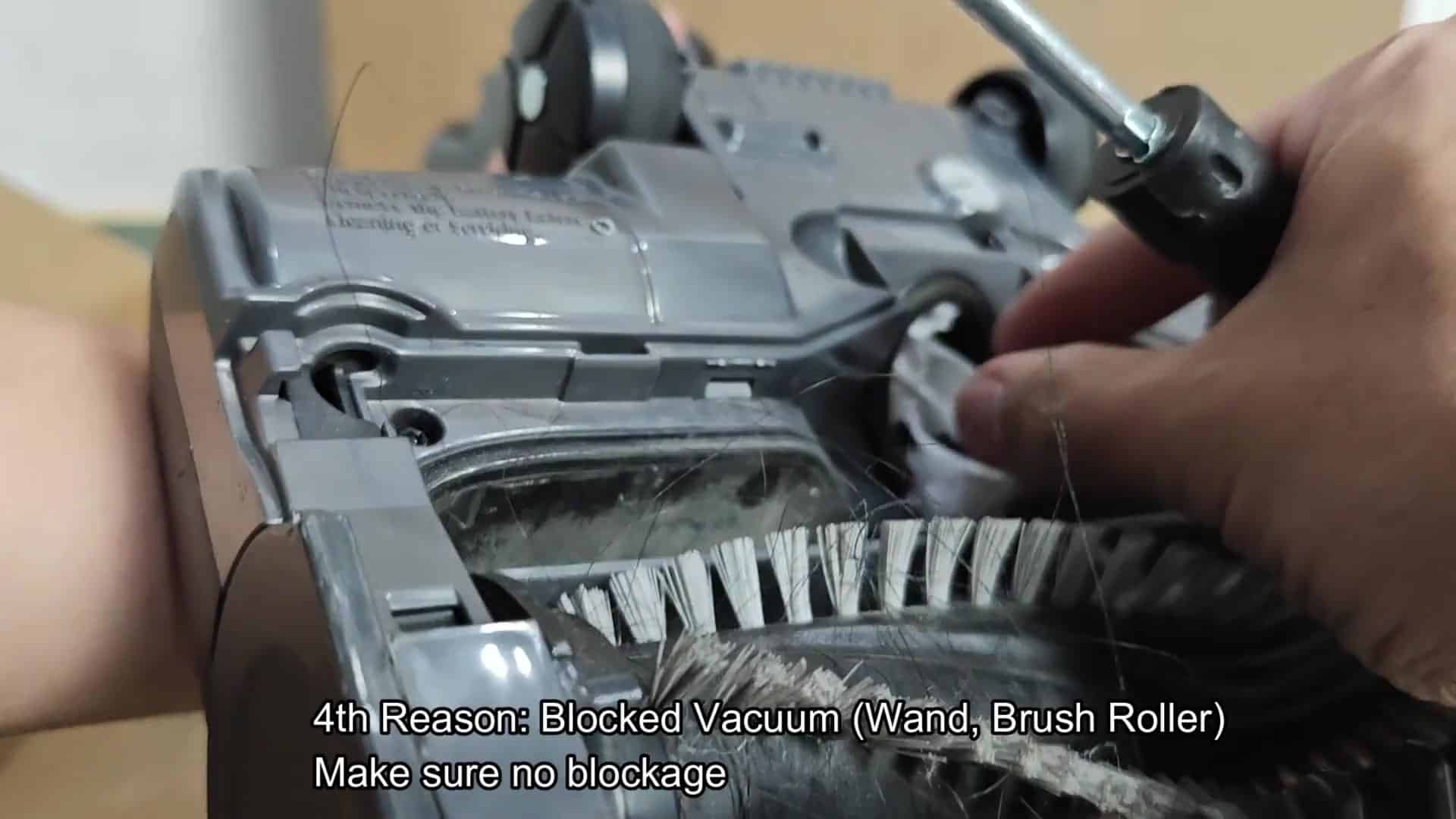 Clearing debris from vacuum intake port Clearing debris from vacuum intake port