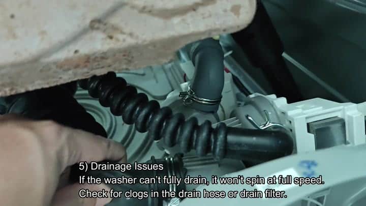 Coiled black drain hose connection Coiled black drain hose connection