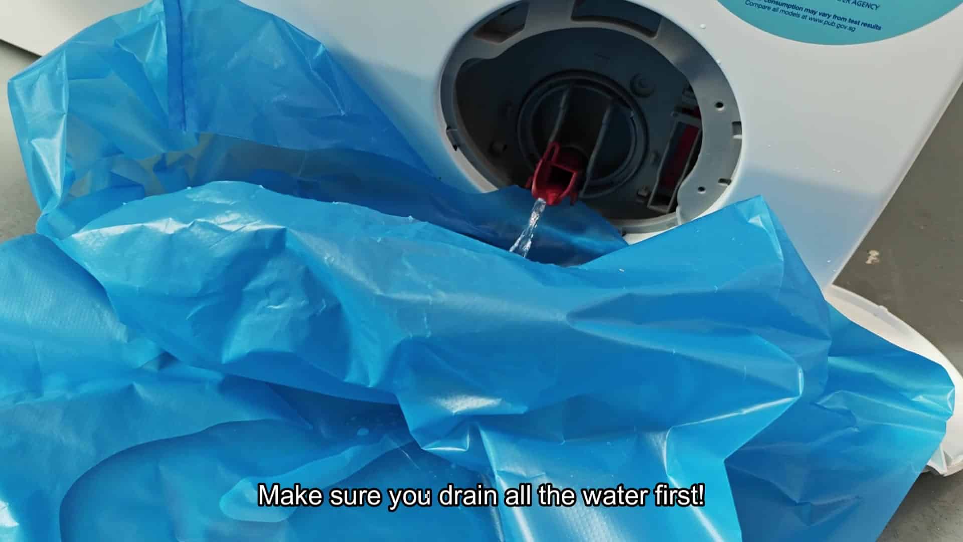 Drain filter access with water draining out Drain filter access with water draining out