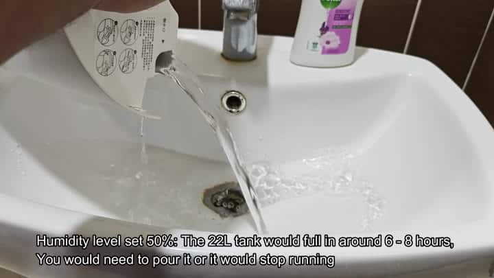 Emptying collected water into the sink Emptying collected water into the sink