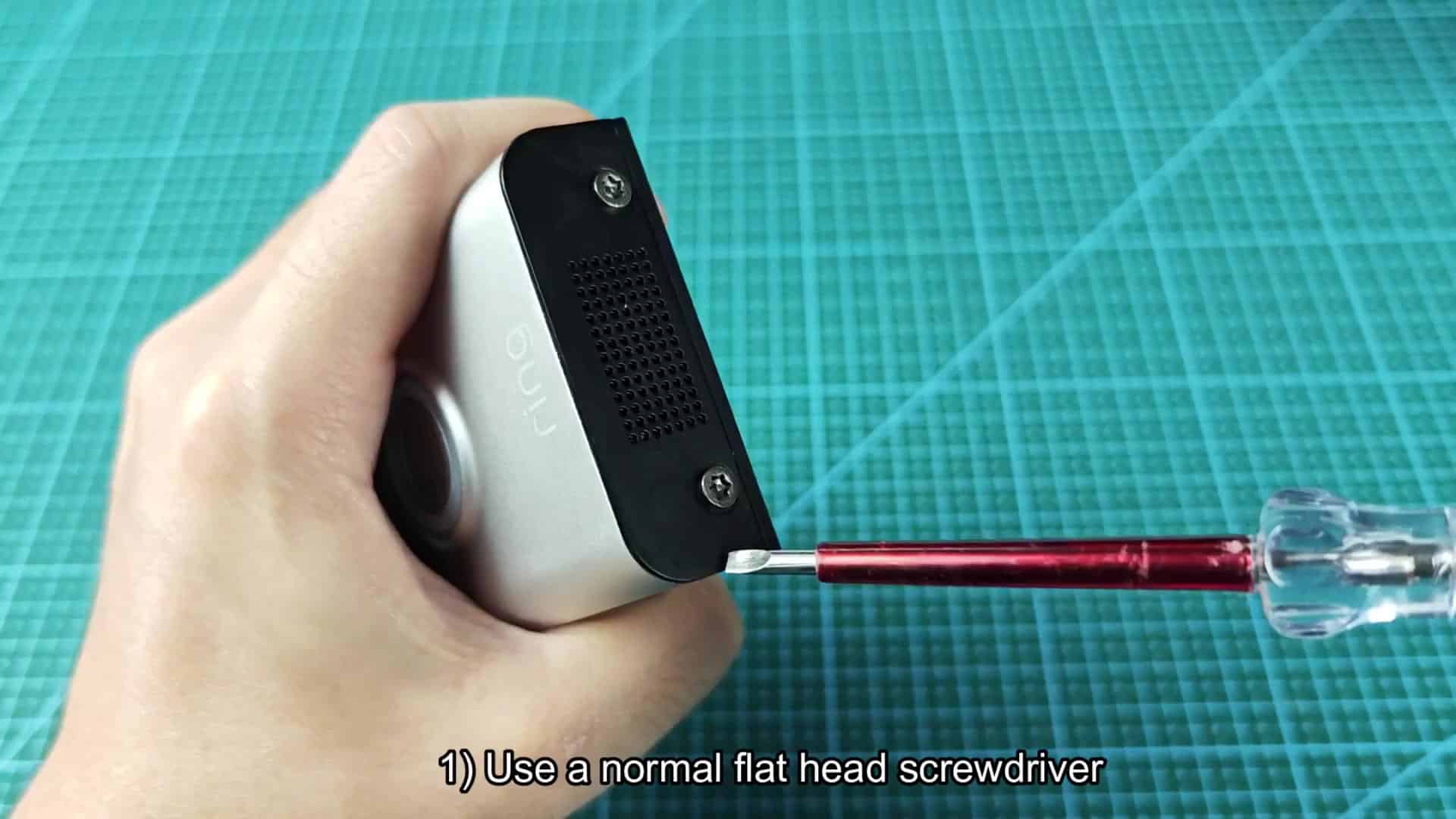Flathead screwdriver in lower screw Flathead screwdriver in lower screw