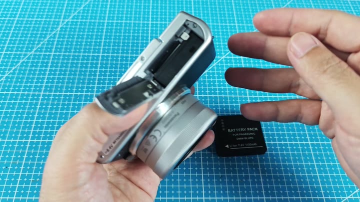 Gesturing towards replacement battery pack Gesturing towards replacement battery pack