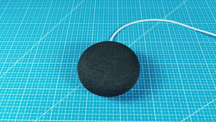Google Nest Mini on blue mat Google Nest Mini on blue mat