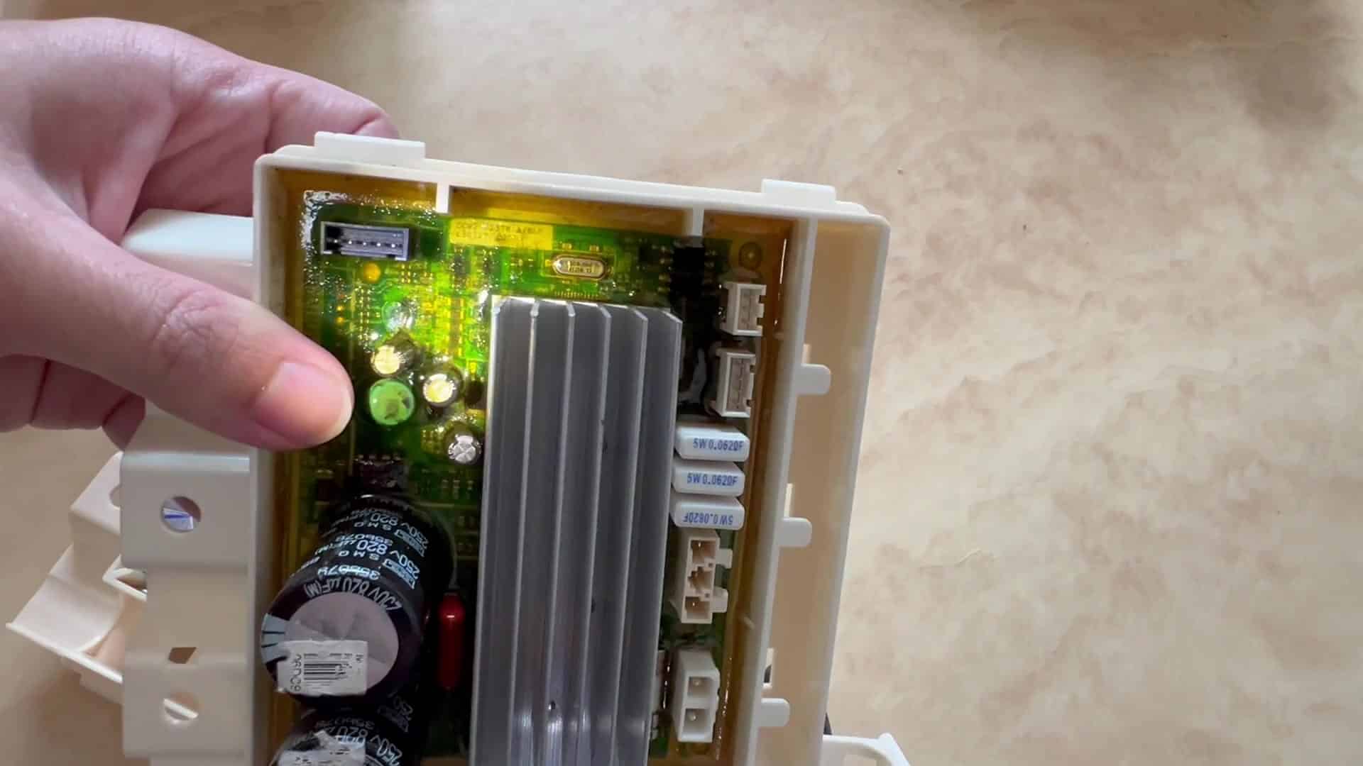 Green PCB inside white housing Green PCB inside white housing