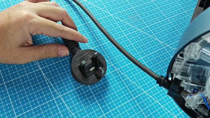 Holding UK style power plug Holding UK style power plug