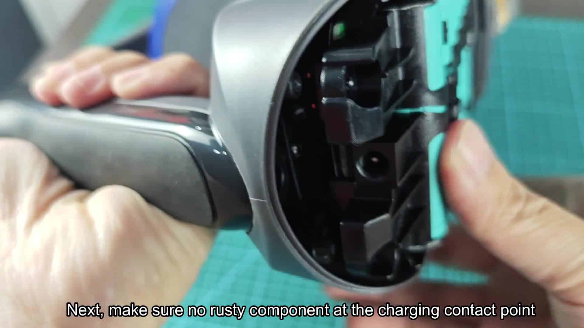 Inserting battery pack into vacuum slot Inserting battery pack into vacuum slot