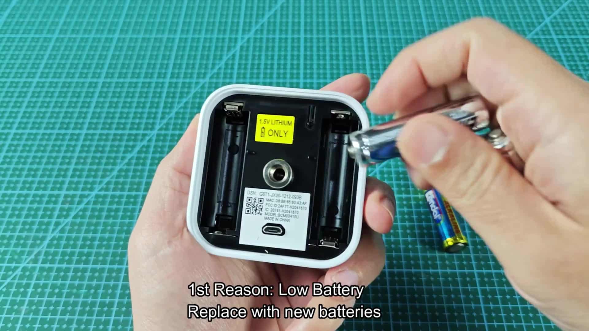 Inserting Energizer lithium AA battery Inserting Energizer lithium AA battery