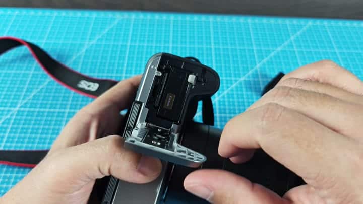 Inserting SD card into camera slot Inserting SD card into camera slot