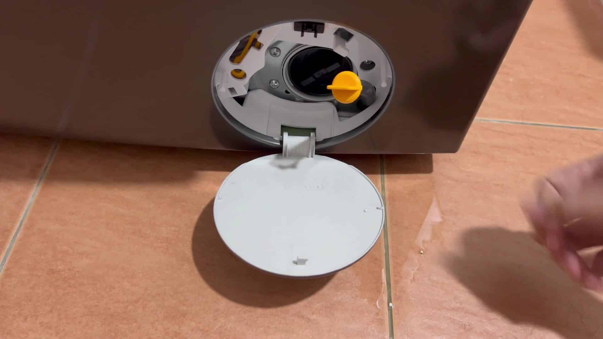 Inserting yellow plastic piece into slot Inserting yellow plastic piece into slot