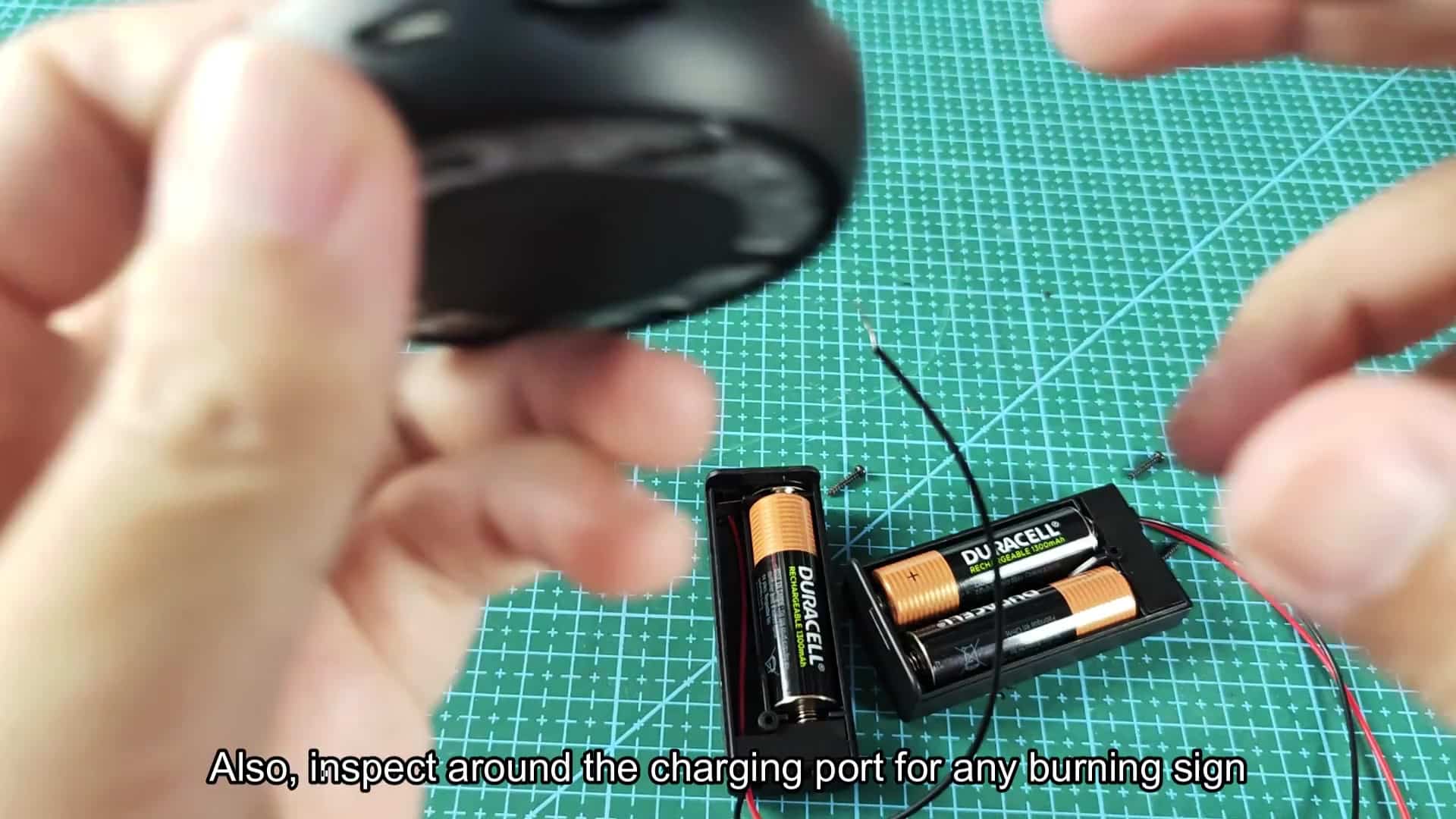 Inspecting charging port for damage signs Inspecting charging port for damage signs