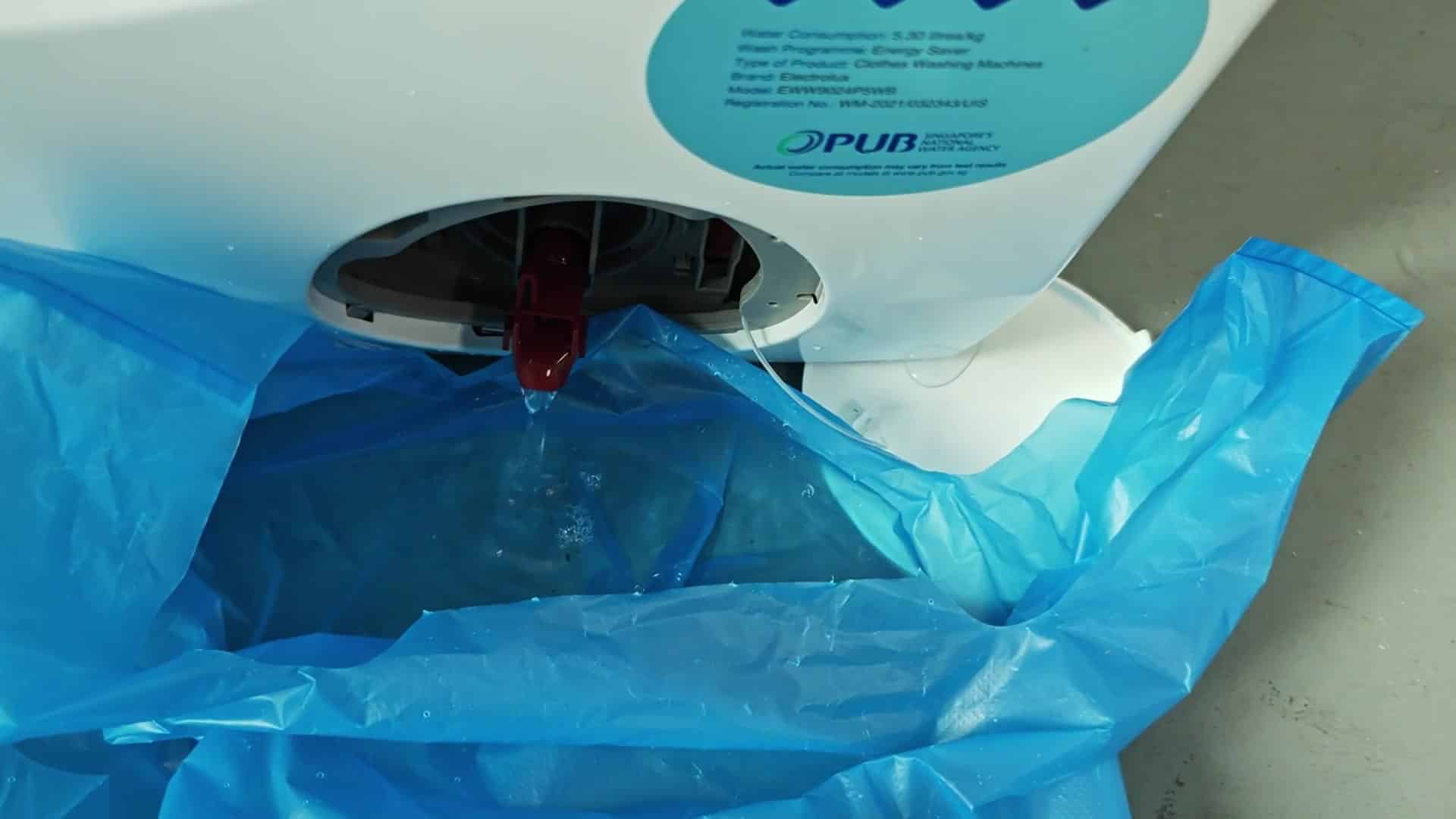 Liquid dripping from red nozzle Liquid dripping from red nozzle