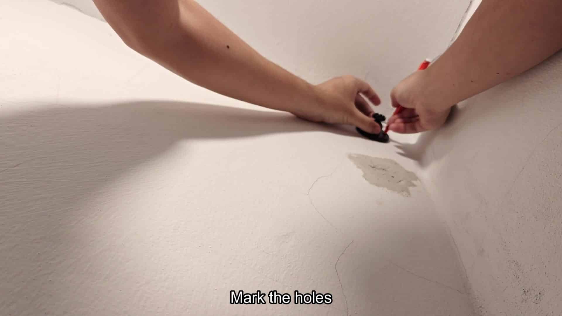 Marking drill hole locations on wall Marking drill hole locations on wall