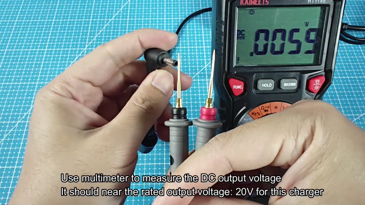 Multimeter checking charger output voltage Multimeter checking charger output voltage