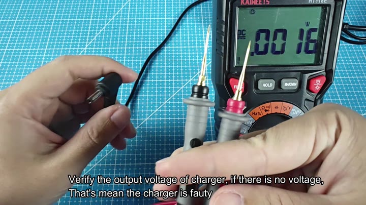 Multimeter checking charger output voltage Multimeter checking charger output voltage