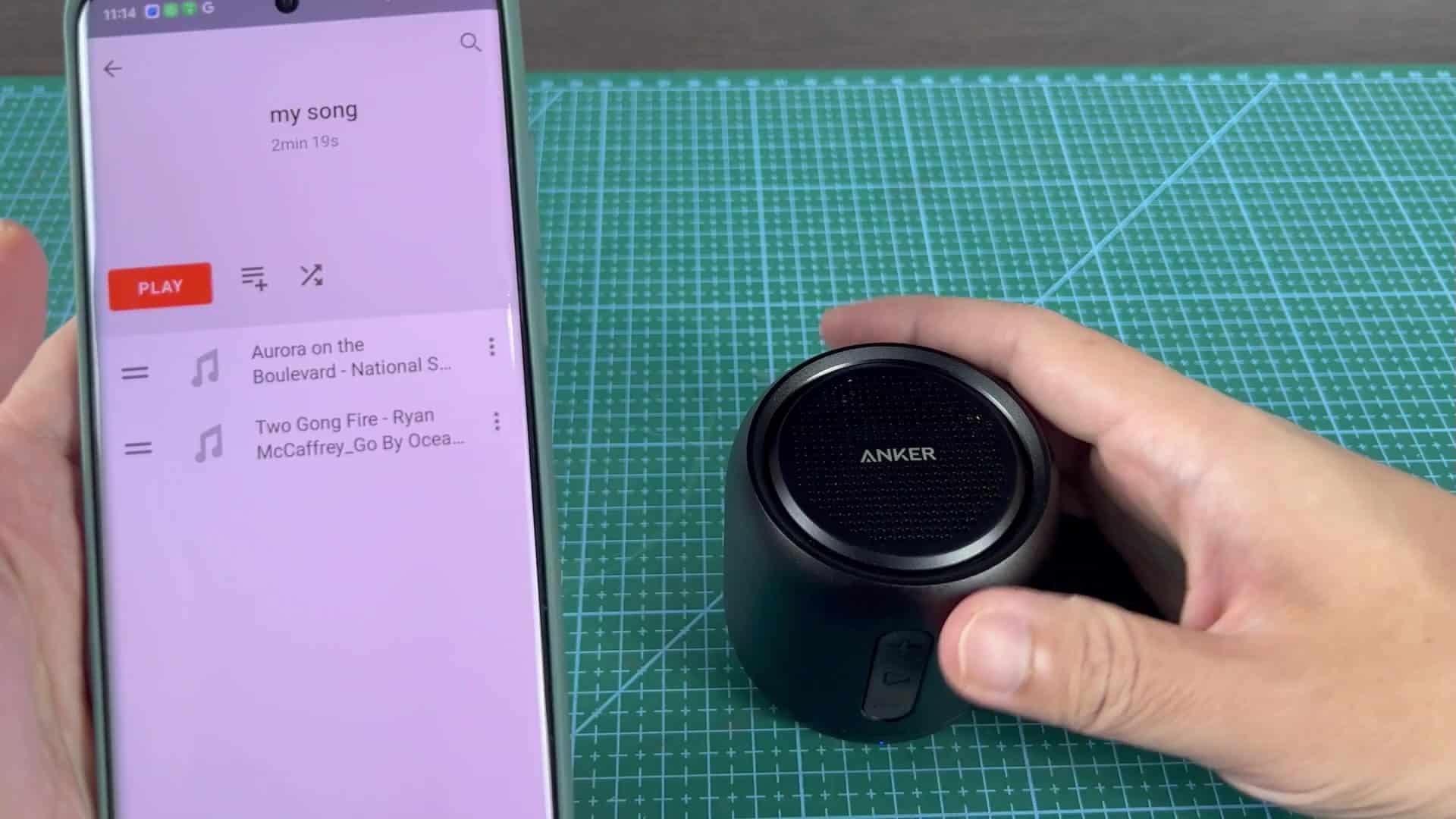 Music playlist next to speaker Music playlist next to speaker