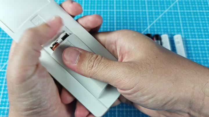 Open battery compartment showing internal contacts Open battery compartment showing internal contacts