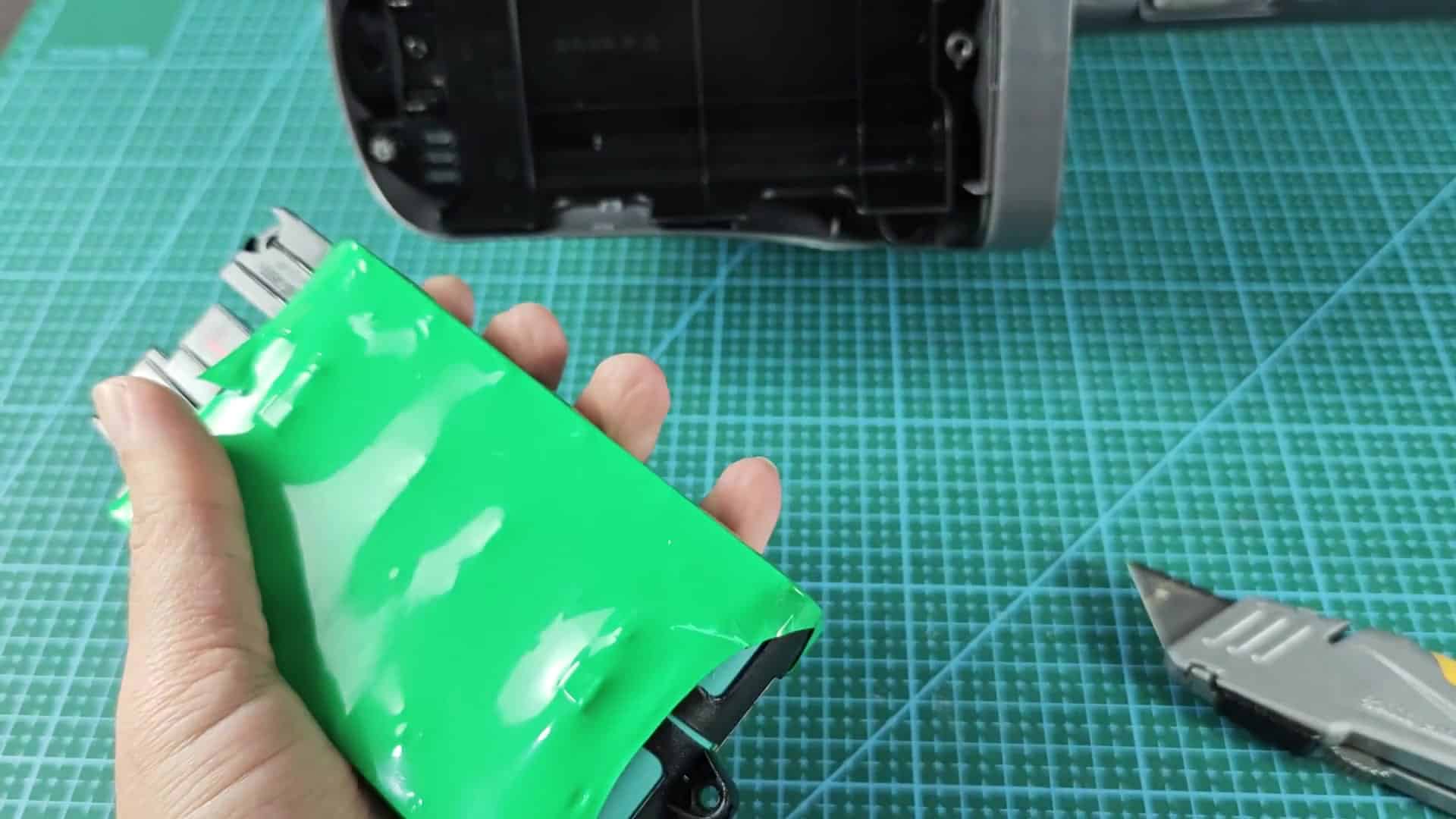 Open battery pack showing six cells Open battery pack showing six cells