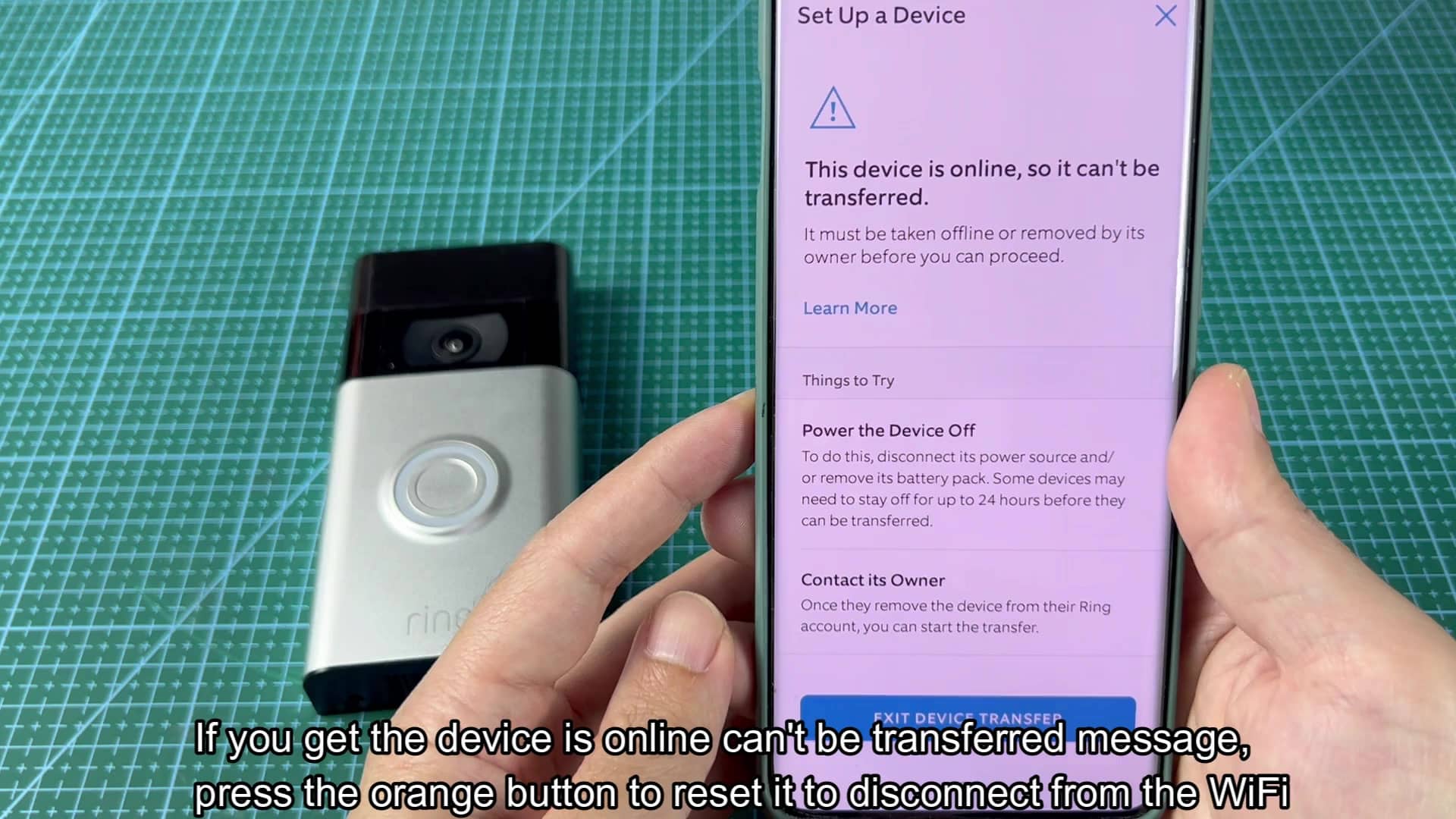 Orange button on back of Ring device Orange button on back of Ring device