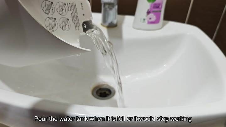 Pouring water from tank into sink Pouring water from tank into sink