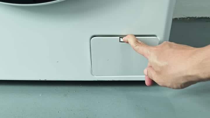 Pressing button on appliance side panel Pressing button on appliance side panel
