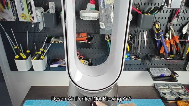 Pressing button on Dyson base Pressing button on Dyson base