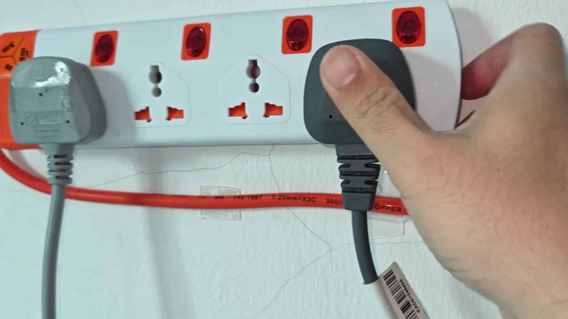 Pressing red switch on power strip Pressing red switch on power strip