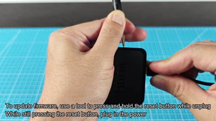 Pressing reset button with small tool Pressing reset button with small tool