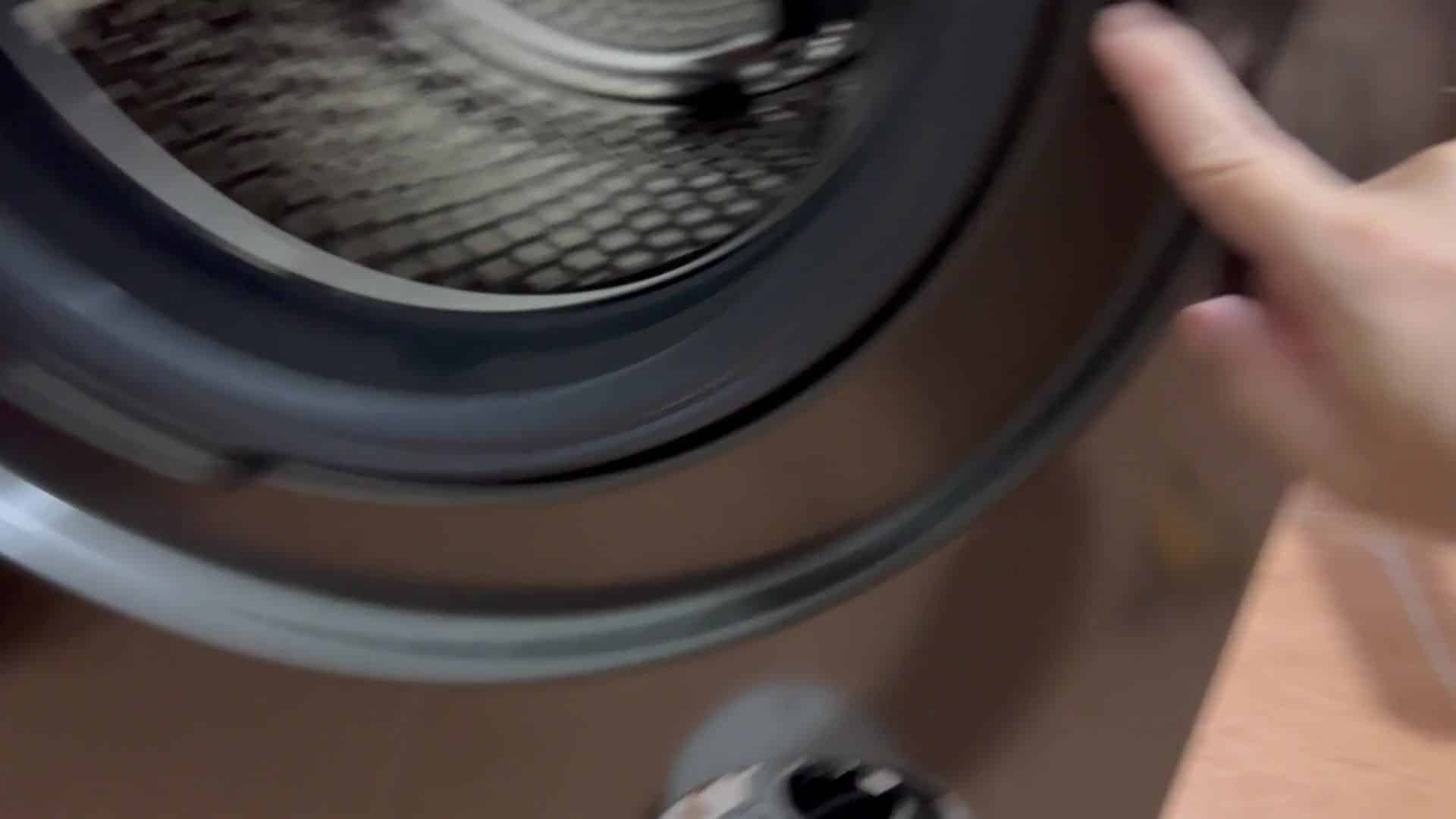 Pressing small button near door hinge Pressing small button near door hinge