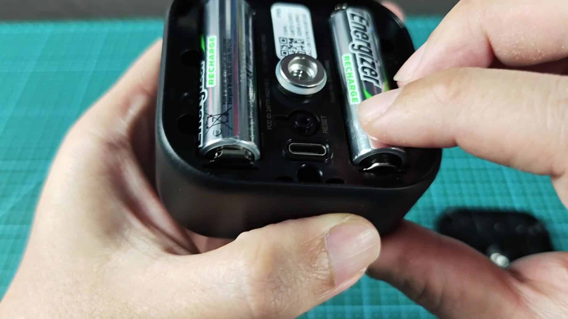 Resetting camera by pressing recessed button Resetting camera by pressing recessed button