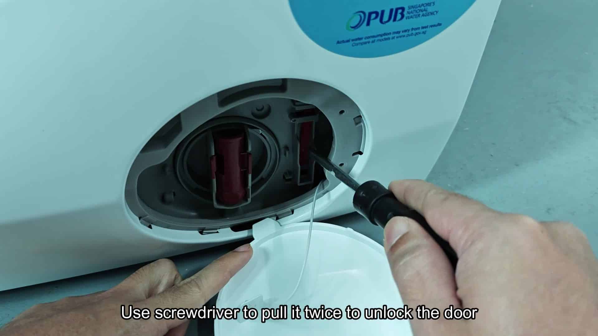 Screwdriver inserted to pull latch twice Screwdriver inserted to pull latch twice