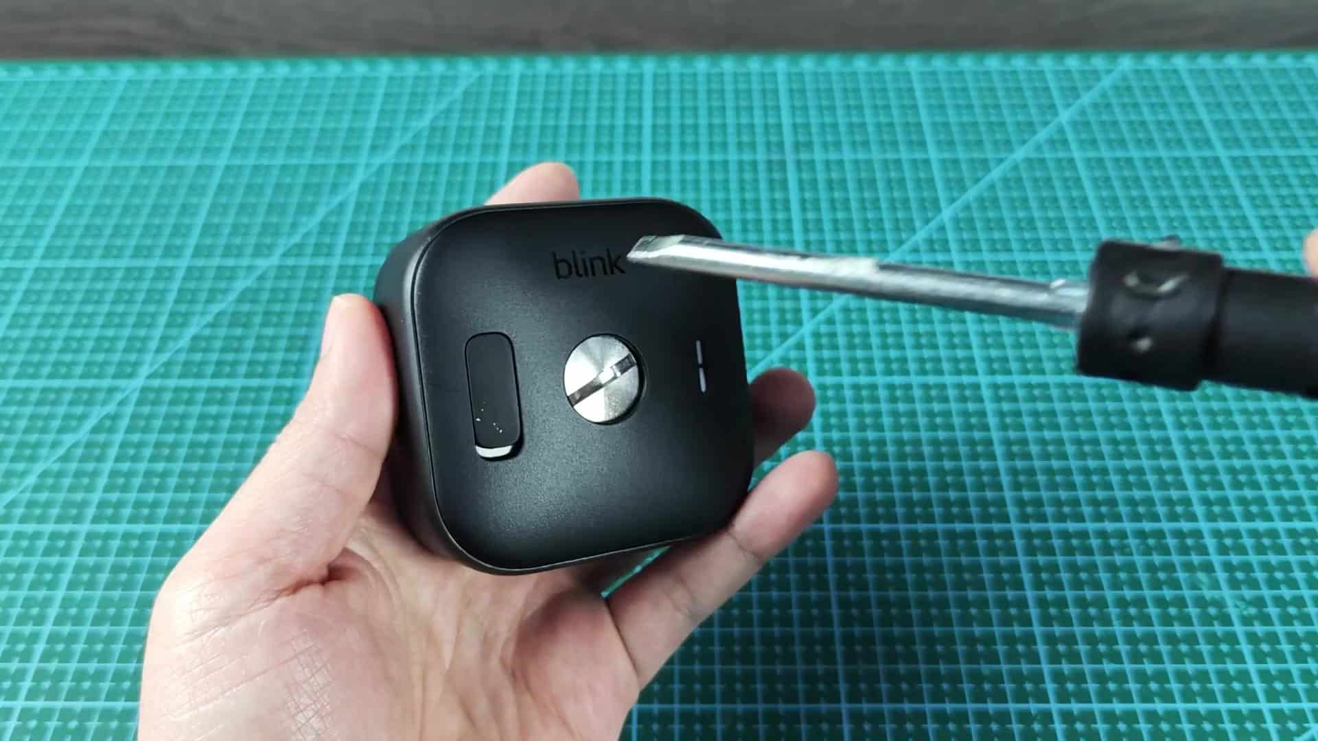 Screwdriver loosening camera back cover Screwdriver loosening camera back cover