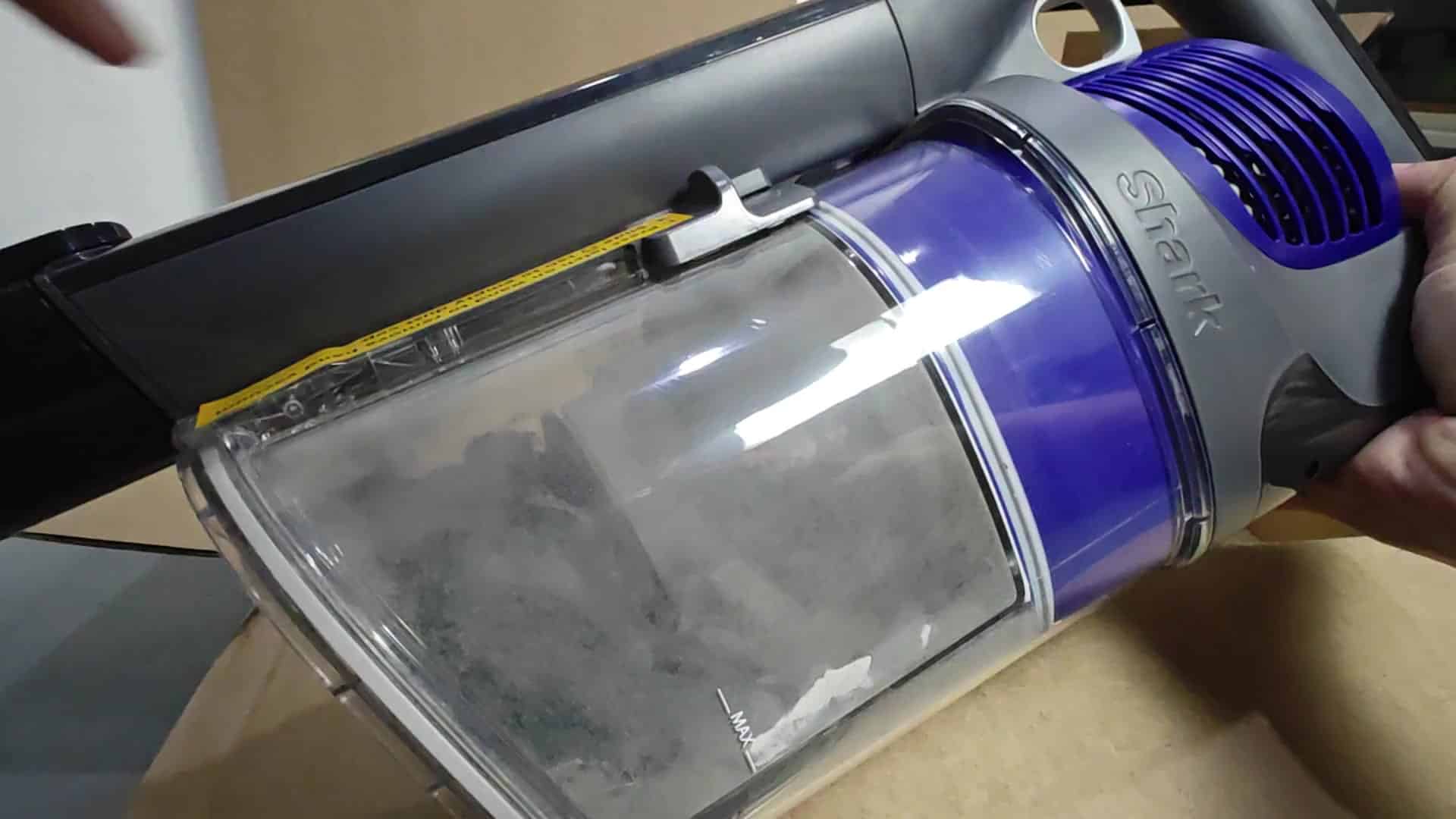 Shark vacuum dustbin filled with debris Shark vacuum dustbin filled with debris