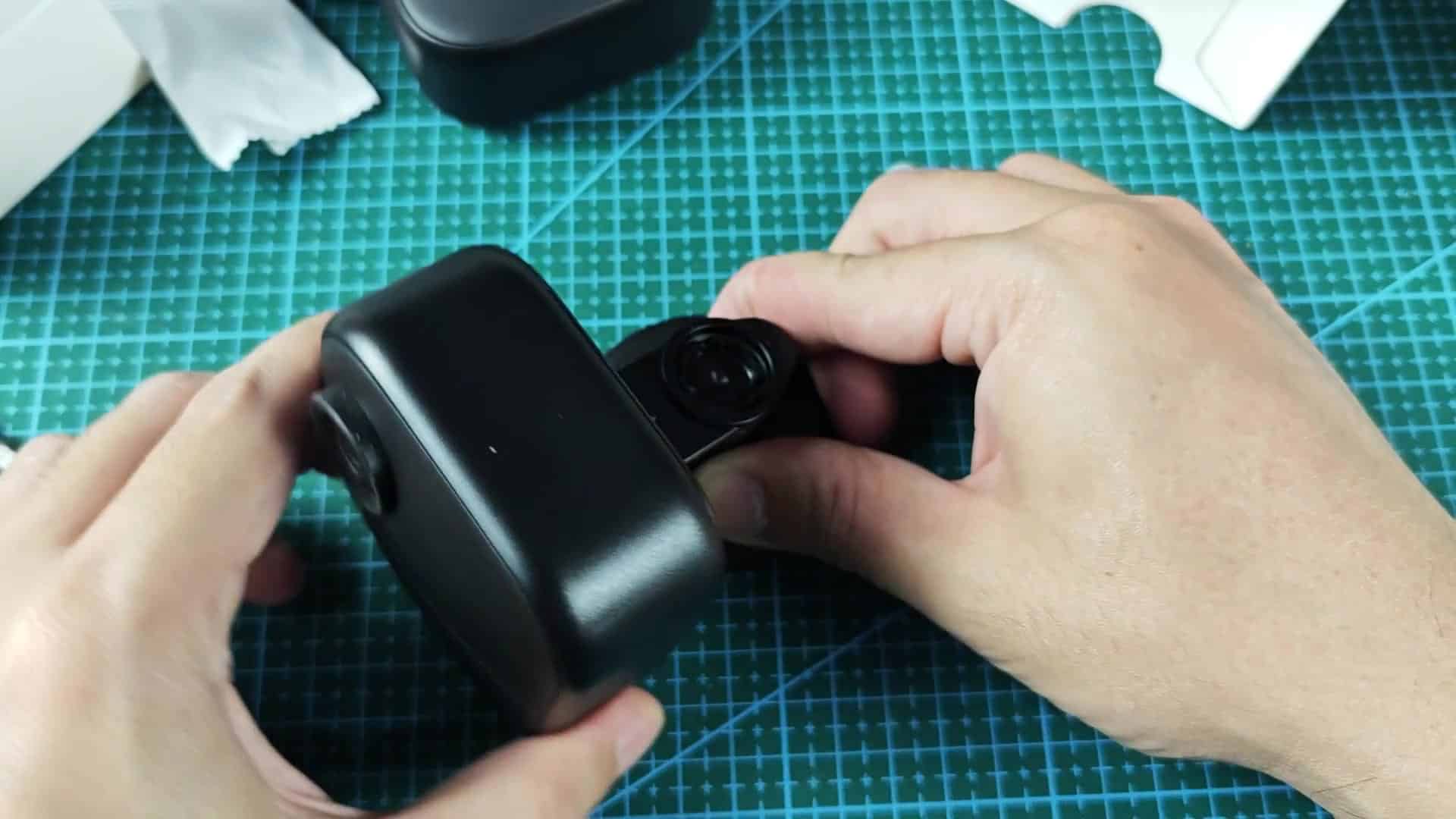 Side profile of lens on black camera body Side profile of lens on black camera body