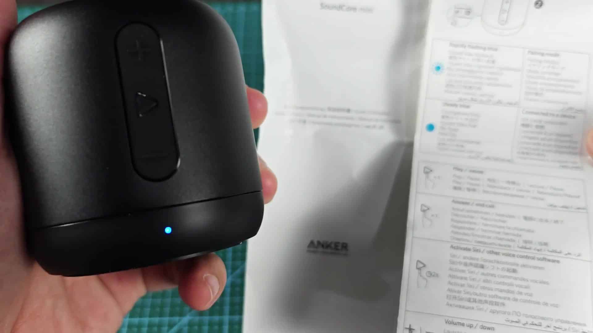 Speaker held next to instruction booklet Speaker held next to instruction booklet