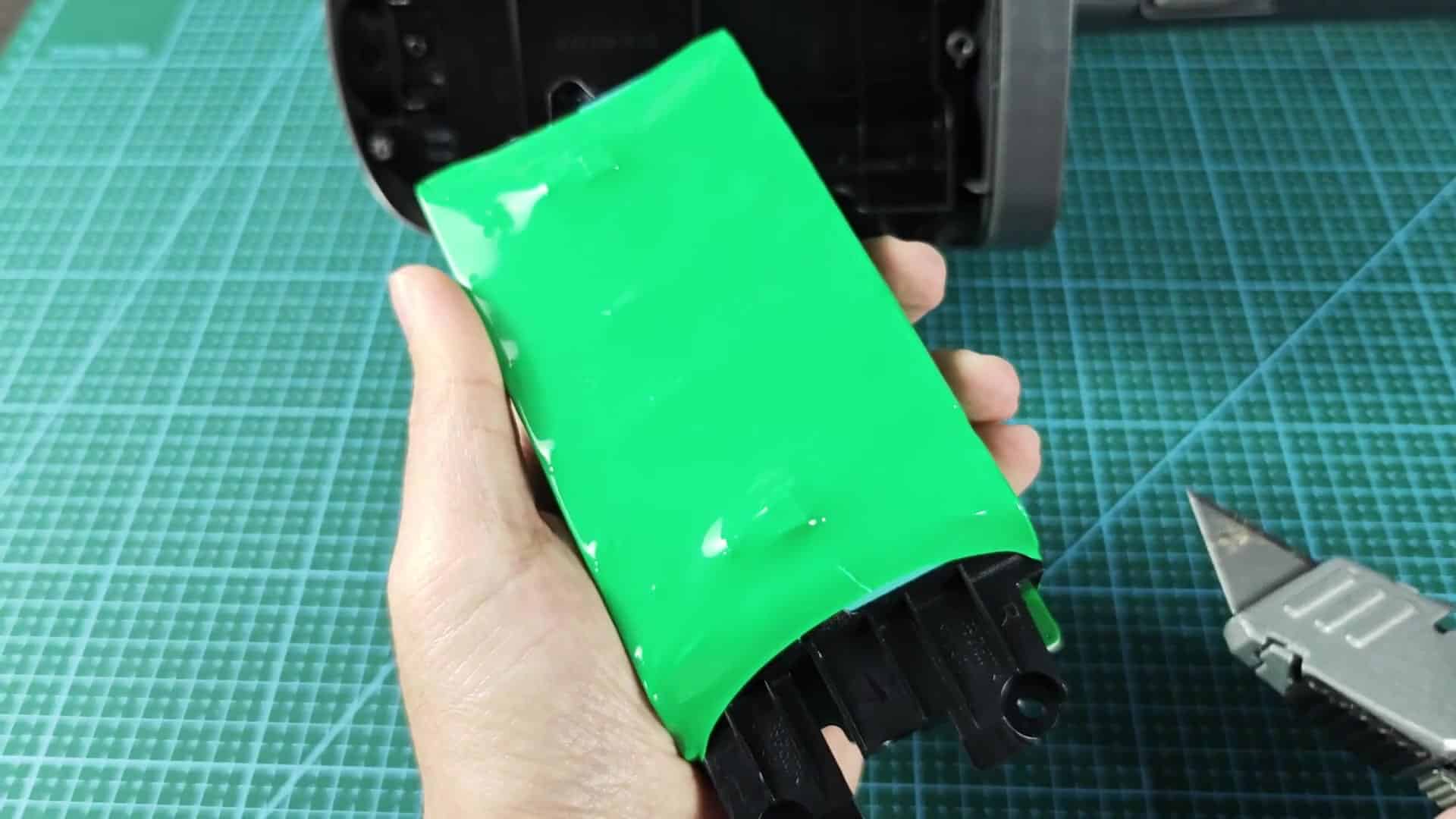 Teal cells inside black plastic holder Teal cells inside black plastic holder