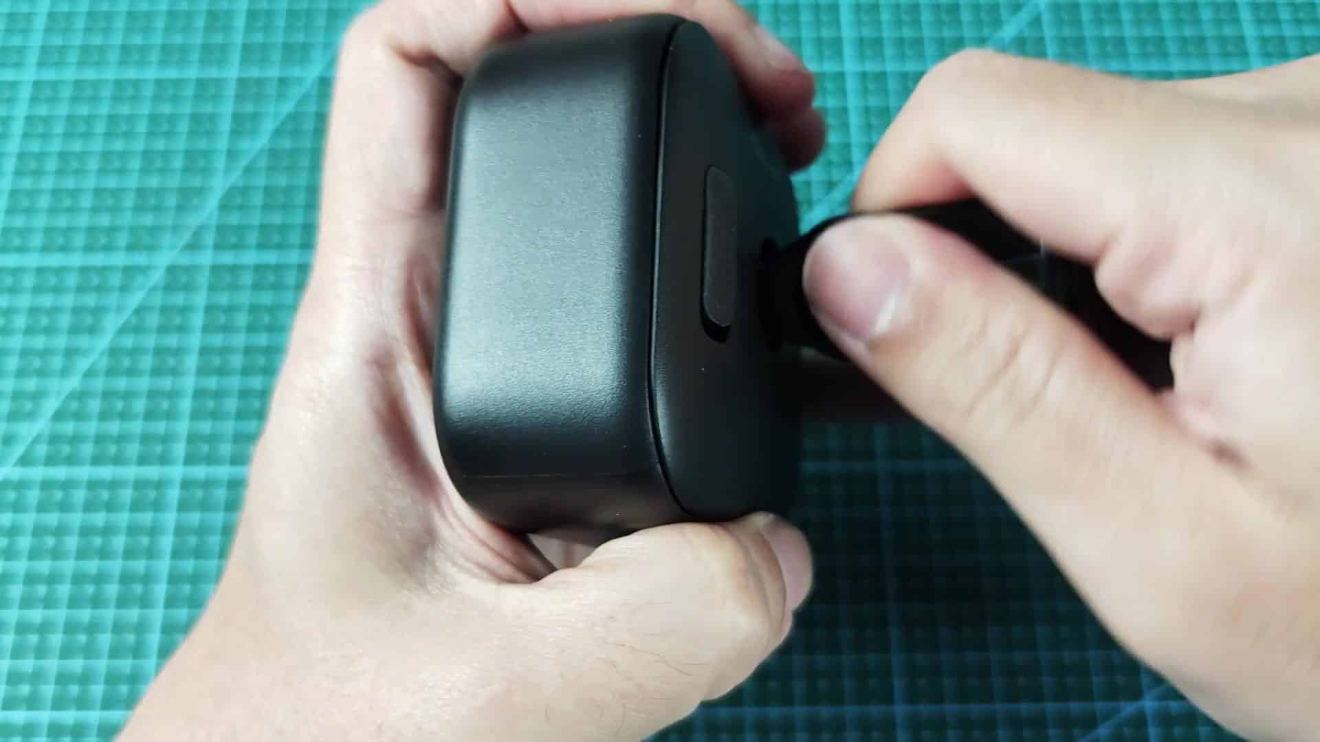 The device is shown in a hand with the brand name “blink” visible on the front, along with a circular metal coin-slot and a small rectangular port/opening; action is presenting the device after adjustment The device is shown in a hand with the brand name “blink” visible on the front, along with a circular metal coin-slot and a small rectangular port/opening; action is presenting the device after adjustment