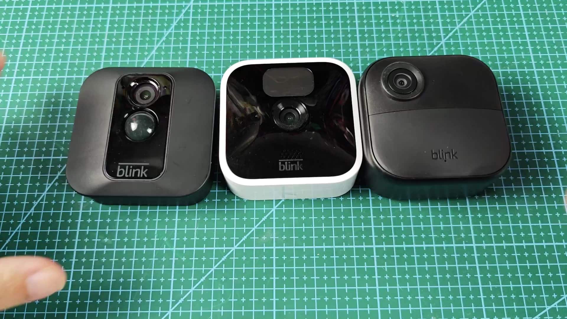 Three Blink cameras arranged on mat Three Blink cameras arranged on mat