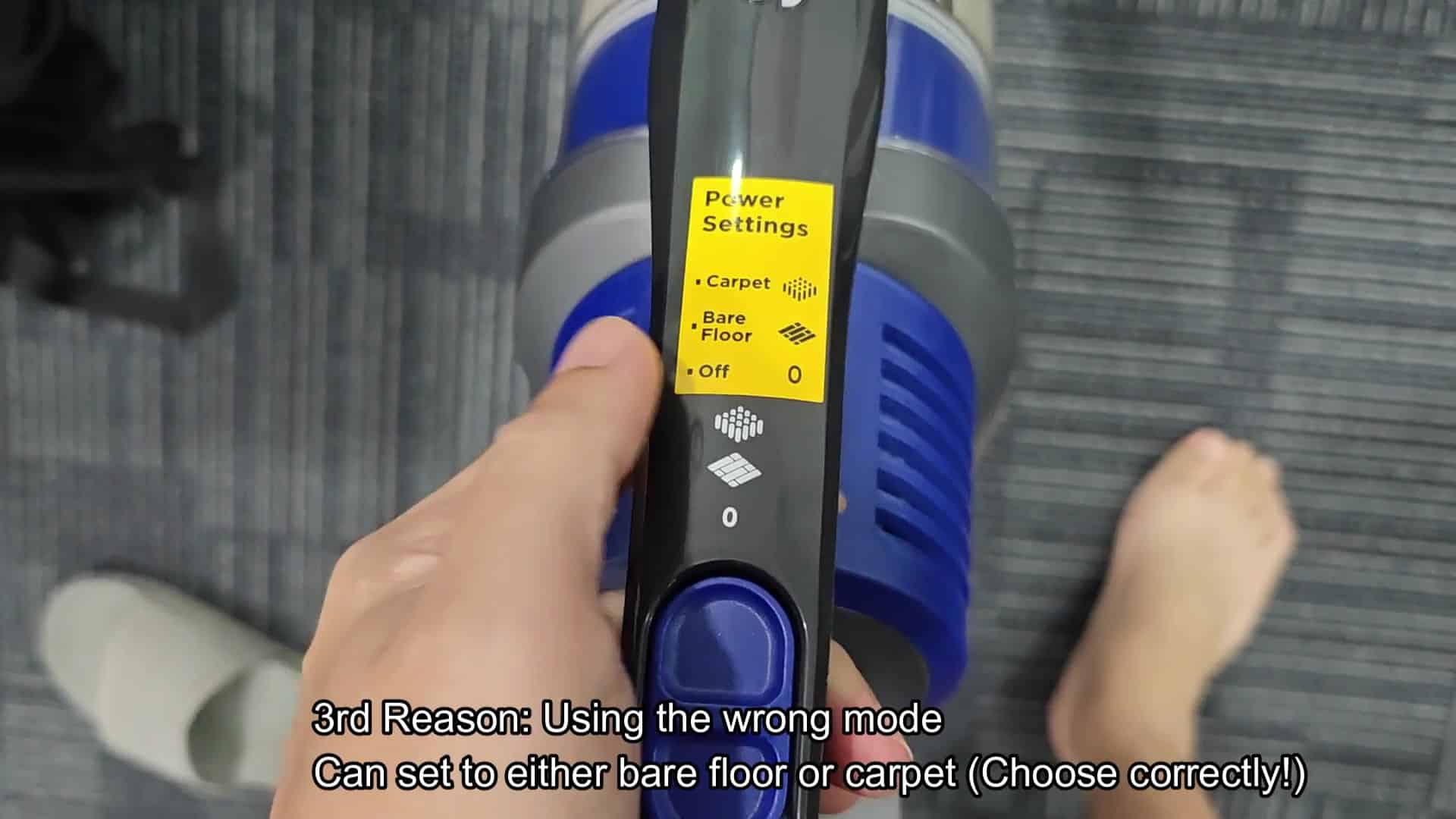 Vacuum head approaching debris pile on carpet Vacuum head approaching debris pile on carpet