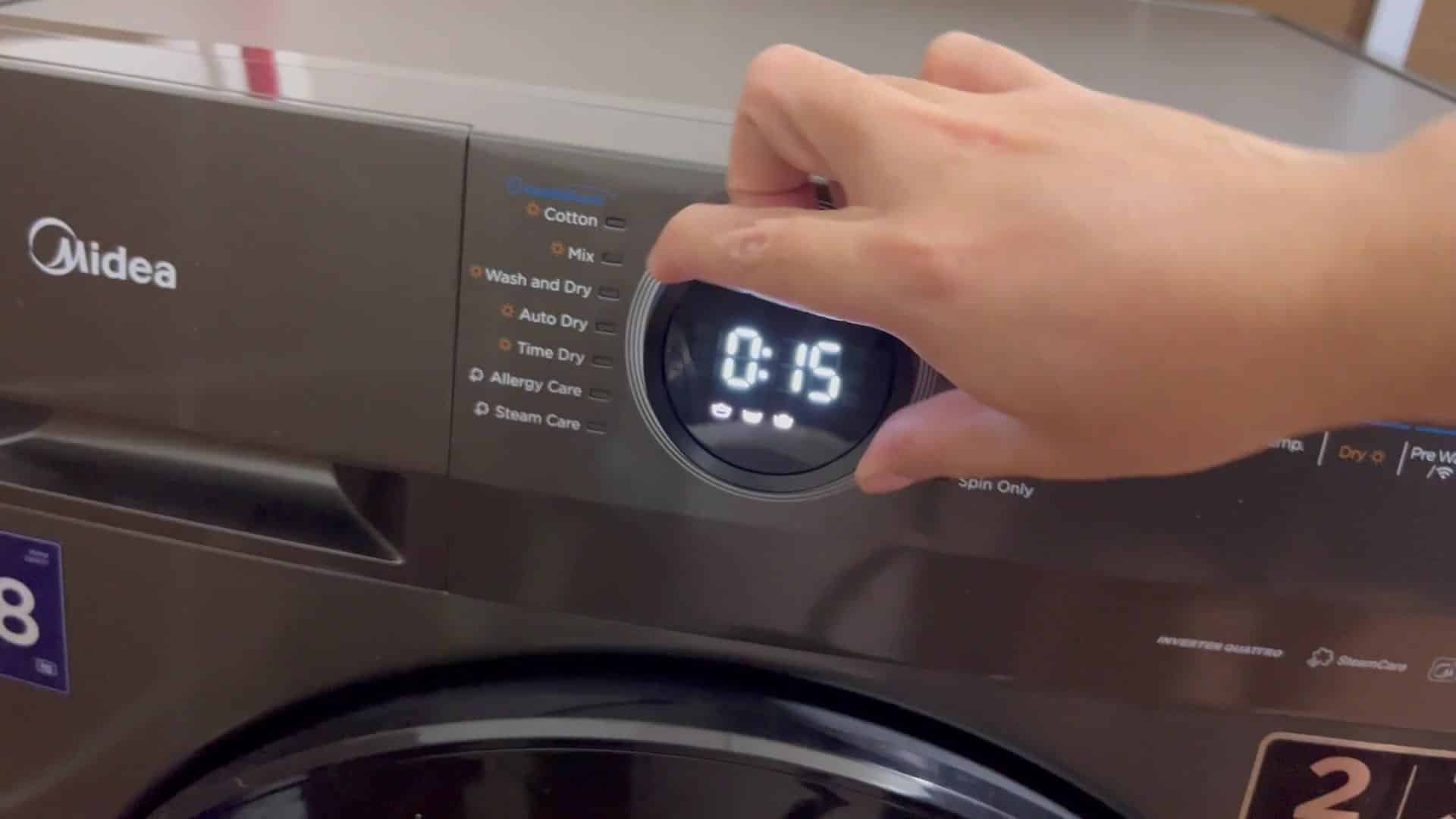 Washing machine timer running with settings visible Washing machine timer running with settings visible