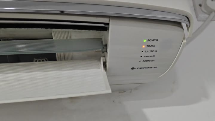 White air conditioner panel with timer light on White air conditioner panel with timer light on